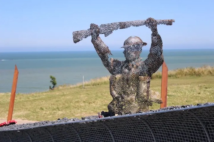 Statue of a soldier at Pointe du Hoc, a key site on a private Normandy D-Day beaches tour, symbolizing American troops' bravery.