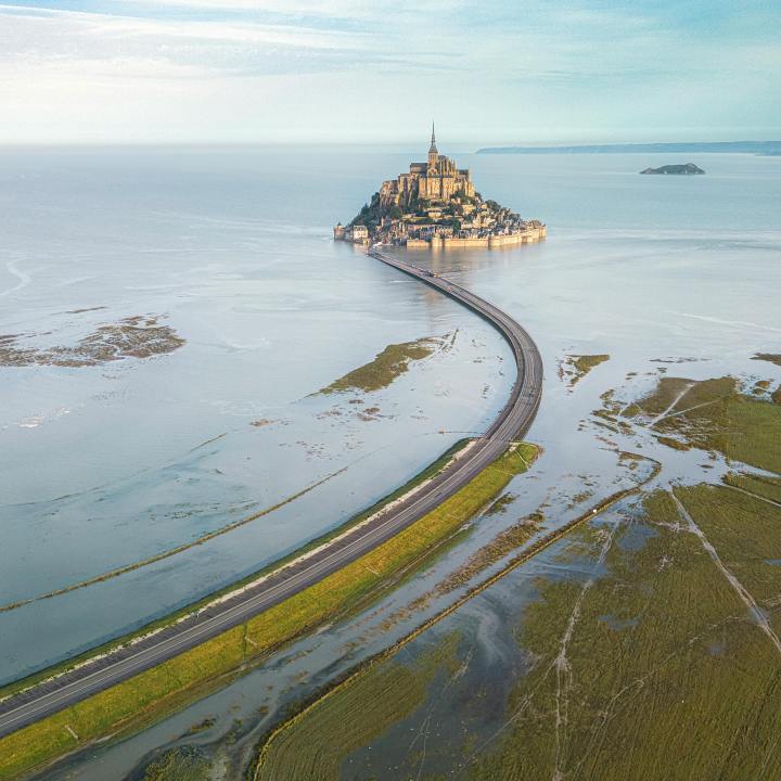 A stunning drone capture of Mont Saint-Michel and its surrounding bay during daytime in Normandy, France.
