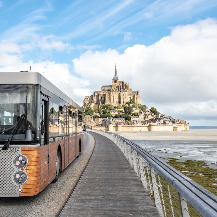 Mont St. Michel, France. Sunday 26 July 2020. The passenger bus takes visitors to Mont St. Michel in France, a popular tourist location.
