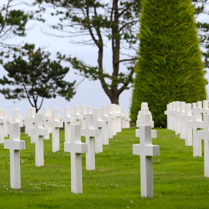 Colleville-sur-Mer, FRA, France - August 21, 2022: American Military Cemetery and many crosses on the graves of the soldiers